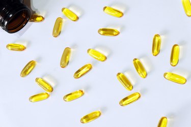 Fish oil capsule on white background