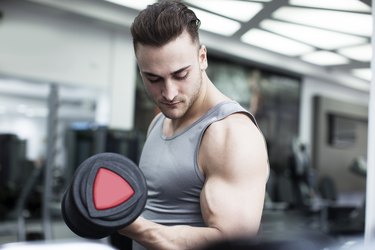 Young Man Exercising with Weights