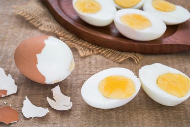 Boiled eggs and wooden plate