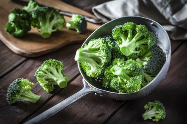 Broccoli in an old metal colander