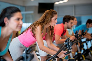 Beautiful woman in a exercising class at the gym