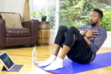 African American adult male doing a core workout