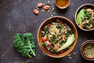 Quinoa salad with kale, cherry tomatoes and pumpkin seeds