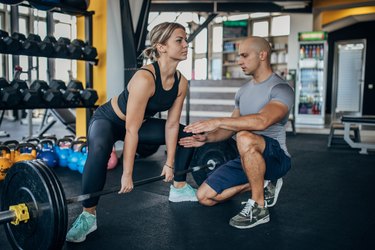 Female athlete practicing dead lift