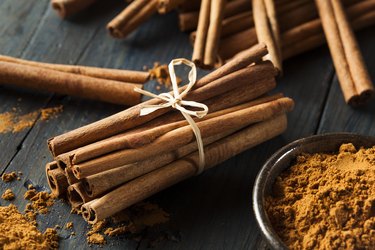 Organic Raw Brown Cinnamon tied up in string on table