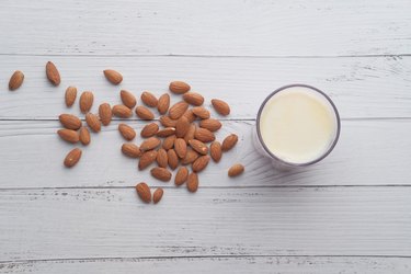 milk and almonds nut on table