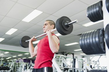 Middle Eastern man exercising in health club