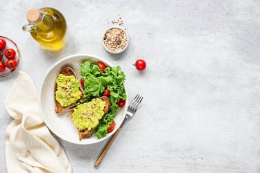 Avocado toast served with fresh green salad