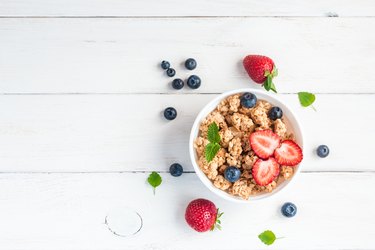 healthy breakfast with muesli and berries, top view, flat lay