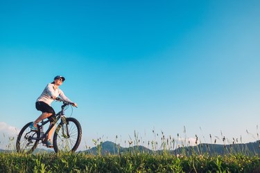 Woman ride a bike: summertime activity