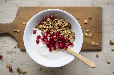 Yoghurt with granola and pomegranate seeds