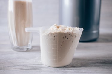 Close-up of protein powder in plastic scoop