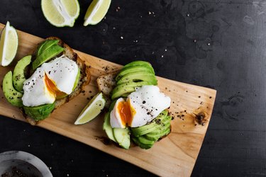 Vegetarian sandwiches with poached egg and sliced avocado