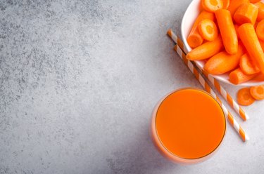 Glass of carrot juice, top view