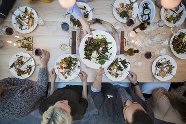 View from above of a group of friends eating at a restaurant table