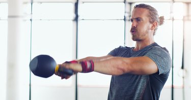 man doing kettlebell swing exercise