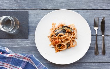 Traditional italian seafood pasta with healthy squid calamari.