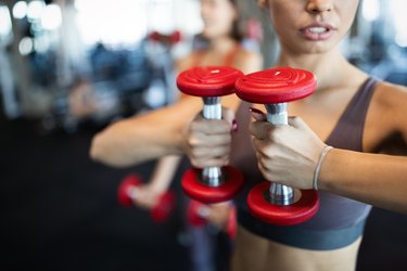 Beautiful fit women working out in gym