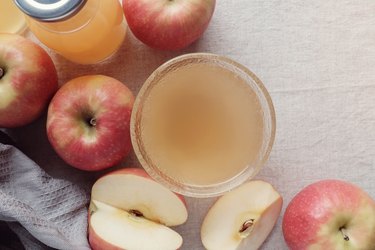 Apple cider vinegar with mother in glass bowl, probiotics food for gut health