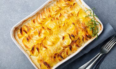 Potato gratin, backed potato slices with creamy sauce. Top view