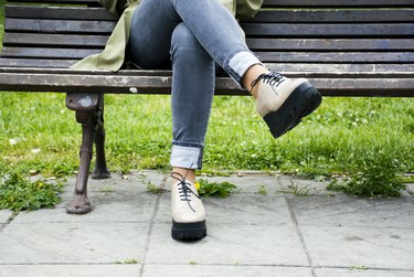 Woman sitting on a bench in a park