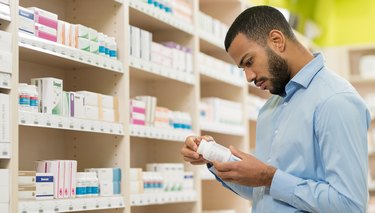 A man shopping for top vitamin brands in a supplement store