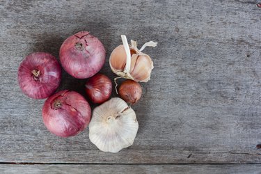 Top View Of Onions And Garlic Wood