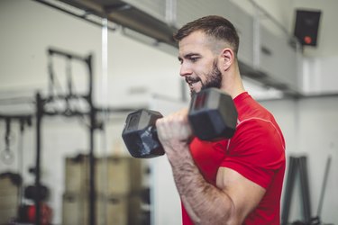 Strong man is doing cross training exercise