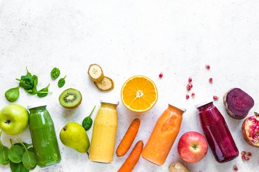 Various smoothies bottles and ingredients