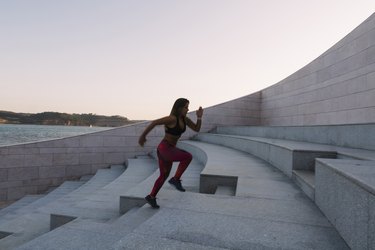 Woman running up steps