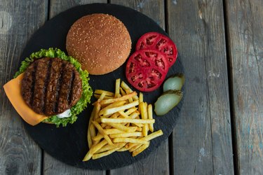 Directly Above Shot Of Burgers And French Fries On Table