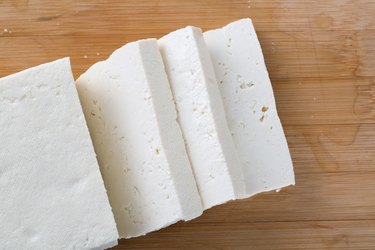 Top view of tofu on wooden table