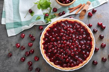 Tasty cherry pie on table