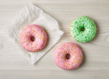 Freshly baked donuts isolated on white background, top view