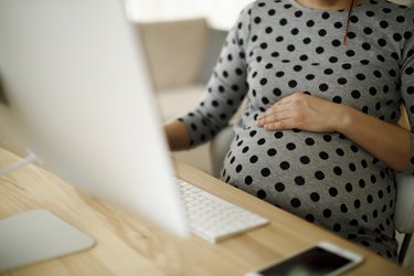 Hypoglycemic pregnant woman working from home office