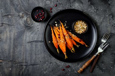 Roasted carrots with dukkah. Vegetarian food. Top view, flat lay, copy space