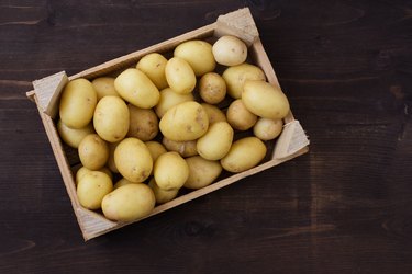 Overhead view of a crate of fresh potatoes