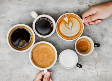 Top view of a variety of coffee drinks on a table