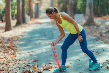 Woman Exercising with Resistance Band