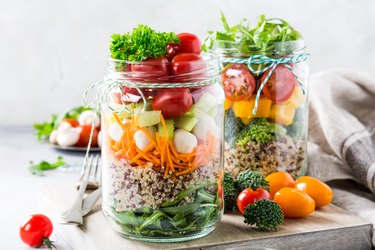 healthy lunch recipe of salad in glass jar with quinoa