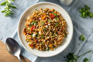 Top view of a nutritious homemade farro and tomato salad