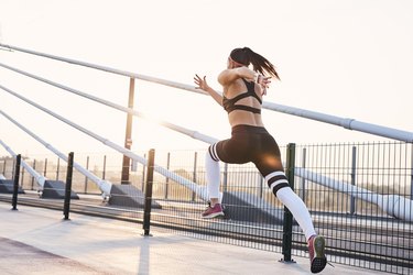 Young woman sprinting in the city