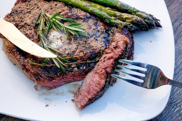 Delicious Rib Eye Steak Grilled to Perfection with Asparagus on the Side Ready to Eat