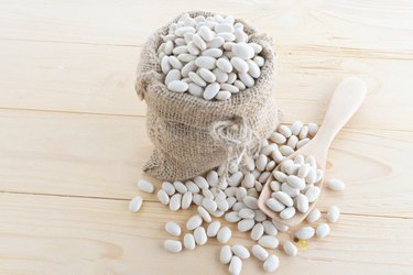 white bean in hemp sack on sack background