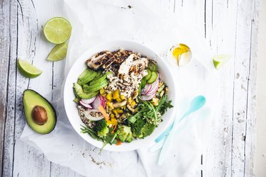 fresh Healthy Quinoa Bulgur bowl with vegetables and chicken