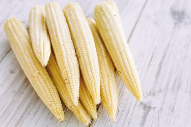 Fresh Baby corn on wooden background