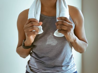 Sweat-Soaked Woman Finishes Indoor Cycling Session