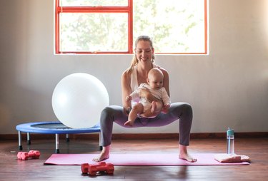 A young mother doing a beginner leg day workout at home
