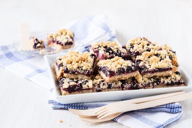 Homemade currant cornmeal crumble bars with streusel topping