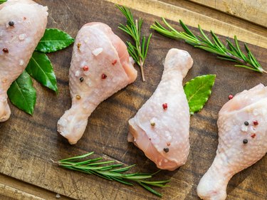 Chicken legs with spices and salt  ready for cooking.